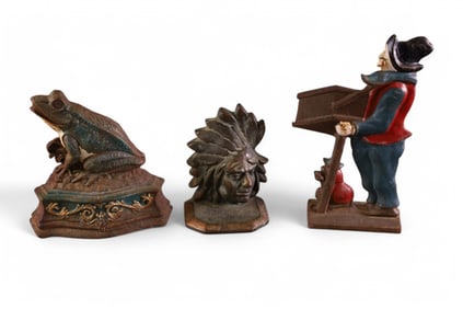 3 CAST IRON DOORSTOPS