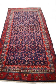 APPROX 9' 6" x 4' 8" HANDMADE WOOL RUG
