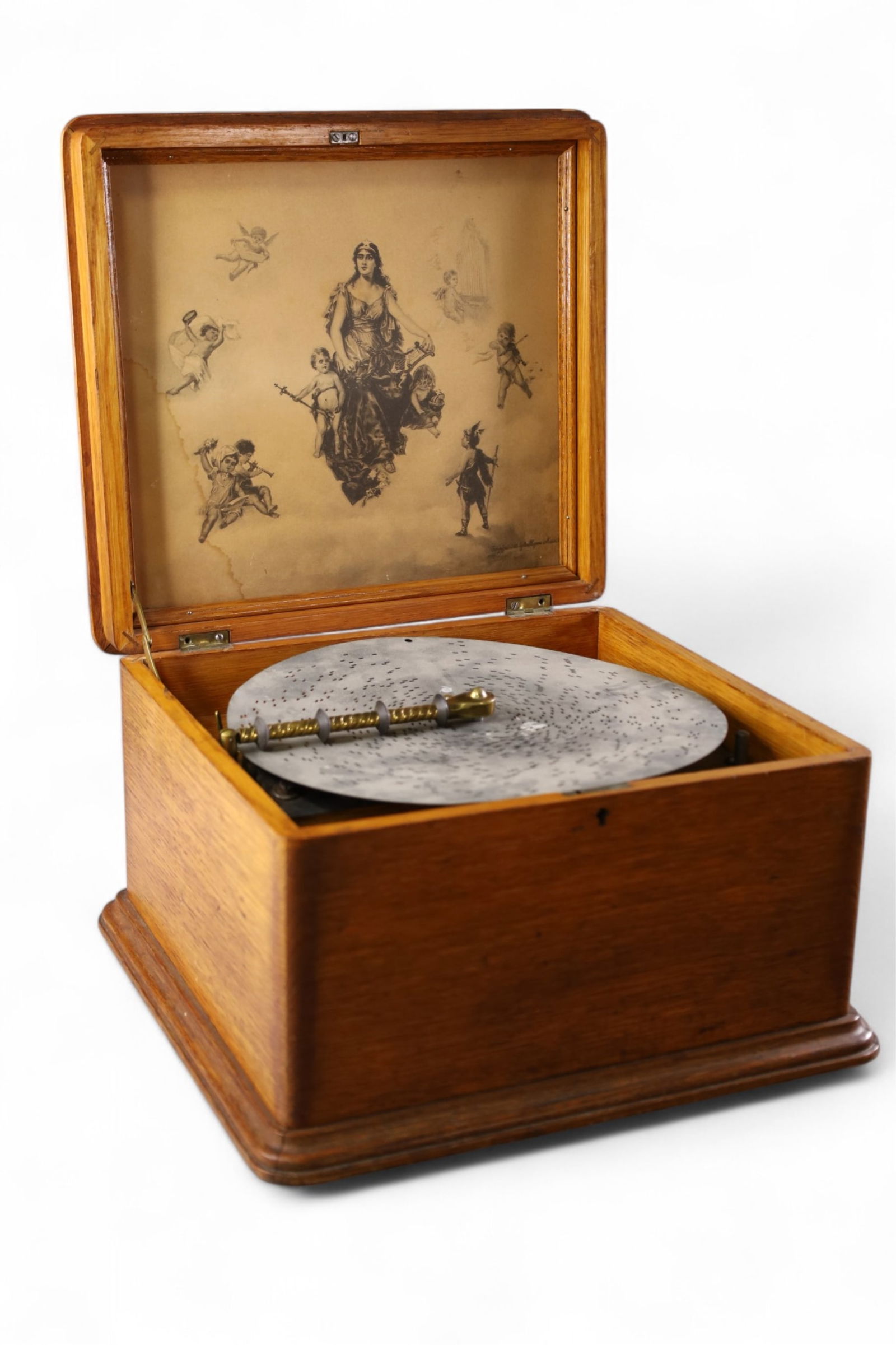 ANTIQUE REGINA MUSIC BOX: REGINA HINGED LID MUSIC BOX, ONE BROKEN TOOTH, WITH CRANK, WORKS. 11 INCH DISK. 13" x 13" x 9 1/2" H.