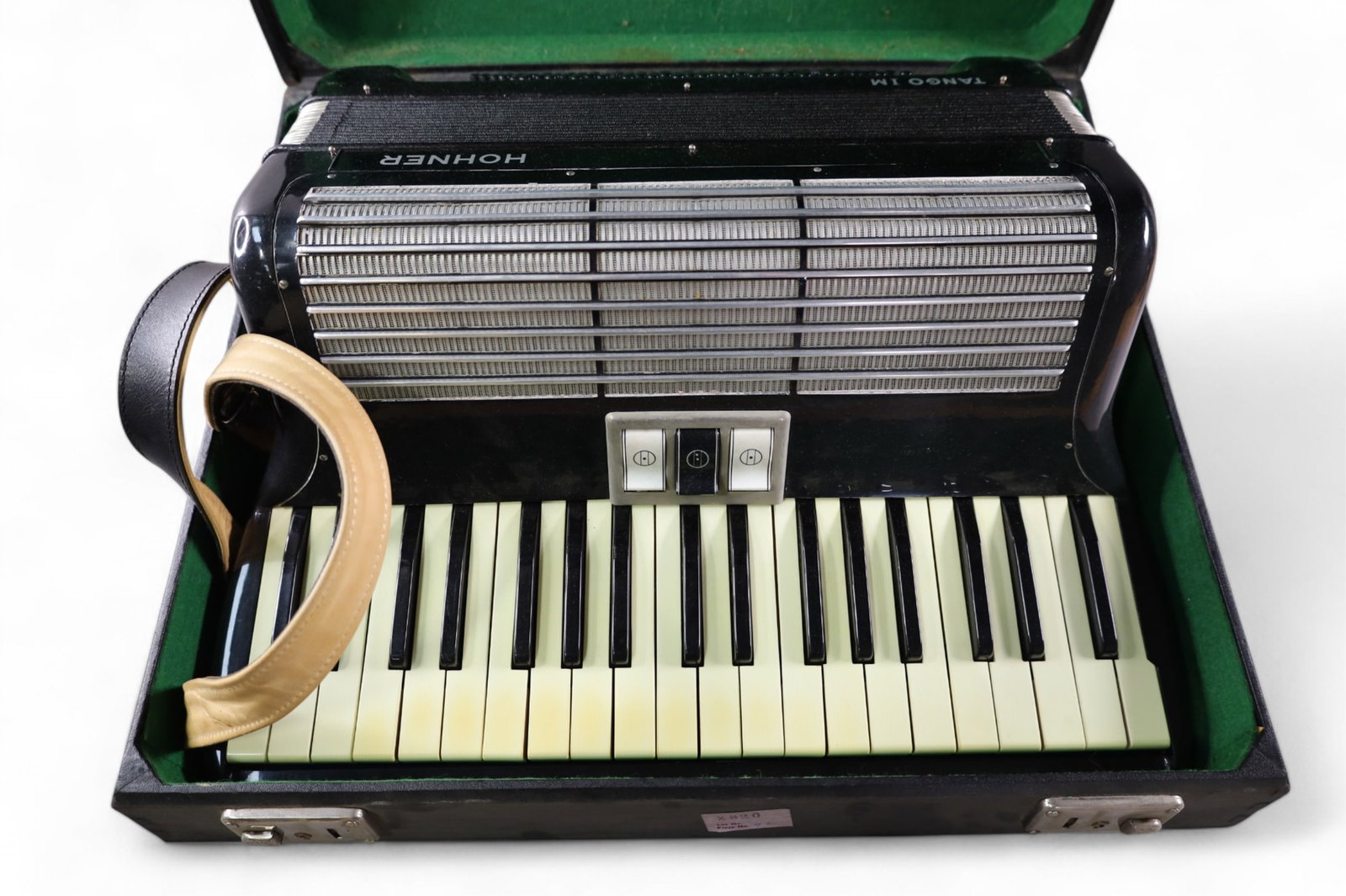 HOHNER ACCORDIAN IN CASE: HOHNER TANGO IM. ACCORDIAN. IN CASE. THIS ITEM EXCEEDS SIZE/WEIGHT LIMITATIONS FOR IN HOUSE SHIPPING, MUST BE PICKED UP IN HOUSE OR SHIPPED VIA 3rd PARTY GROUND SHIPPER.