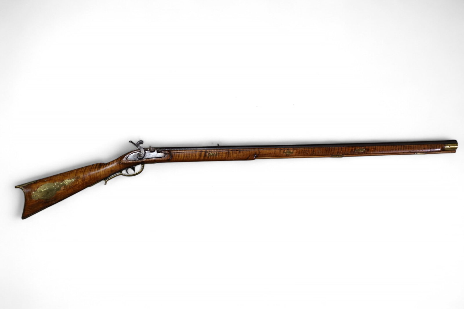 ANTIQUE WALL HANGER RIFLE: ANTIQUE WALL HANGER RIFLE, FLINTLOCK RIFLE, BRASS DECORATED. 55" L. THIS ITEM EXCEEDS SIZE/WEIGHT LIMITATIONS FOR IN HOUSE SHIPPING, MUST BE PICKED UP IN HOUSE OR SHIPPED VIA 3rd PARTY GROUND SHIPPER.