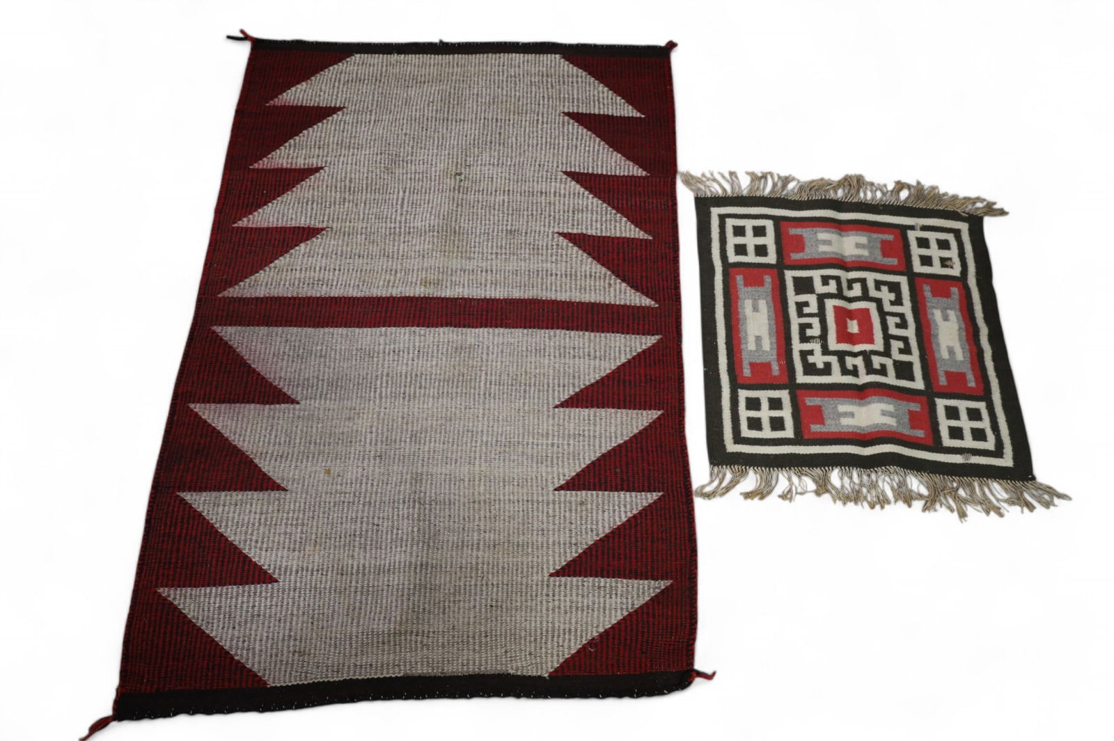 2 NAVAJO WEAVINGS: 2 HANDMADE NATIVE AMERICAN NAVAJO WEAVINGS, SOME HOLES, NEED CLEANED. HAVE SMOKE ODOR. 50" x 31" & 20" x 20"