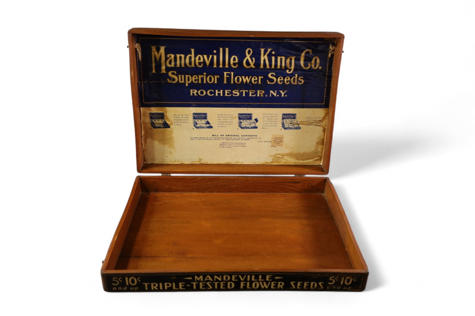 MANDEVILLE SEED BOX: HINGED LID WOODEN MANDEVILLE AND KING CO FLOWER SEED BOX. 20" W x 14" D x 4" H.