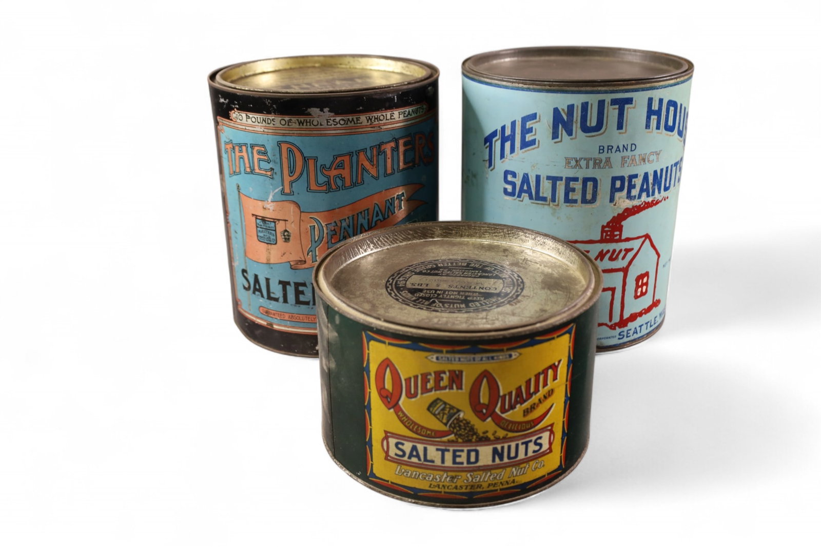 3 PEANUT TINS: PLANTERS, THE NUT HOUSE, & QUEEN. DENTS, PAINT LOSS.
