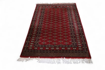 APPROX 4' 1" x 6' 5" HANDMADE WOOL RUG