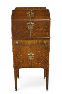 AMERICAN OAK CELLARETTE: AMERICAN OAK ART NOUVEAU CELLARETTE WITH CURVED TWO DOOR UPPER, FITTED INTERIOR. LOWER DRAWER & TWO LOWER DOORS. POLISHED BRASS ACCENTS. 22" W x 17" D x 53"H. THIS ITEM EXCEEDS SIZE OR WEIGHT LIMITATI