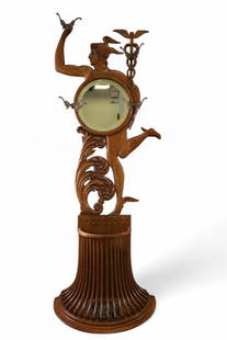 AMERICAN OAK MERCURY HALLTREE: AMERICAN OAK FIGURAL HALLTREE, MERCURY FIGURE, WITH SEMI CIRCULAR STAND BASE. UPPER BEVELED ROUND MIRROR. ORIGINAL DRIP TRAY, 31" W x 84" H. THIS ITEM EXCEEDS SIZE OR WEIGHT LIMITATIONS FOR IN HOUSE S