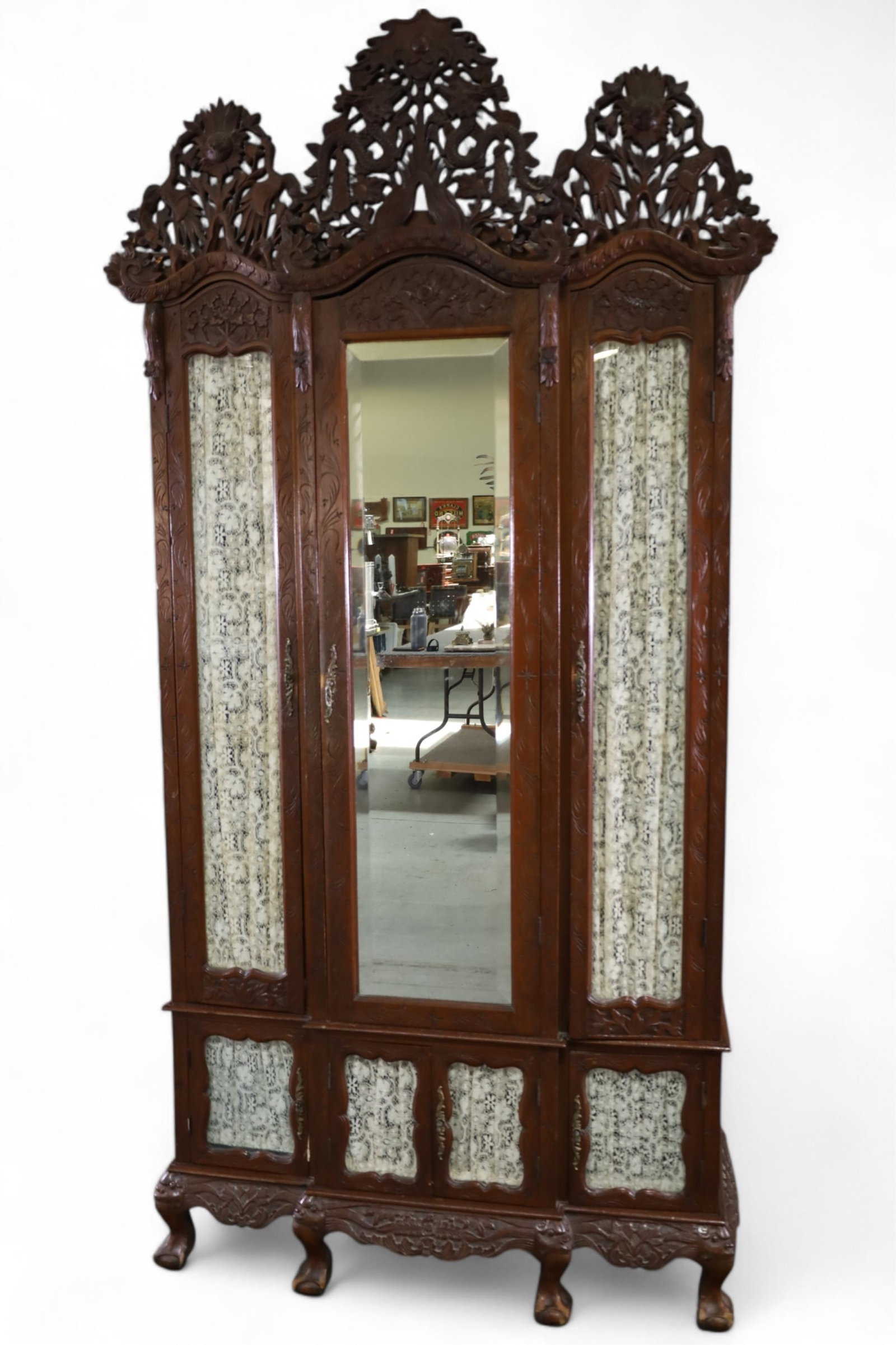 HEAVILY CARVED CHINESE ARMOIRE: LARGE CHINESE ARMOIRE, FABRIC LINED INTERIOR, CARVED UPPER. WEAR TO FINISH. 44" W x 18" D x 94" H. THIS ITEM EXCEEDS SIZE OR WEIGHT LIMITATIONS FOR IN HOUSE SHIPPING, MUST BE PICKED UP IN HOUSE OR SHI