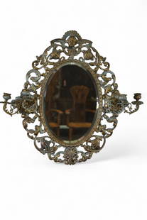 ANTIQUE CANDLE HOLDER WALL MIRROR: GILT METAL CANDLE HOLDER WALL MIRROR, CHERUB DECORATED. 24 W x 22" H.