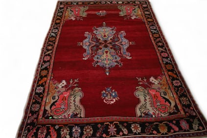 APPROX 8' 8" x 6' 2" HANDMADE WOOL RUG.