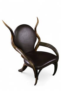 UNUSUAL HORN CHAIR: CUSTOM MADE HORN CHAIR, BRASS TACKED LEATHER UPHOLSTERY. 26" W x 21" D x 40" H. THIS ITEM EXCEEDS SIZE OR WEIGHT LIMITATIONS FOR IN HOUSE SHIPPING, MUST BE PICKED UP IN HOUSE OR SHIPPED VIA 3rd PARTY