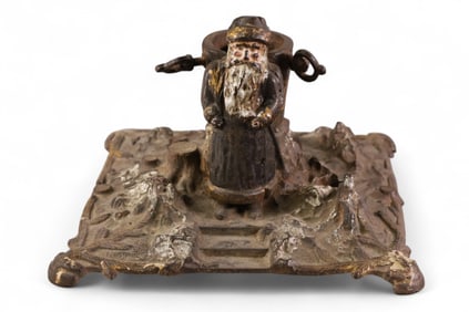 ANTIQUE CAST IRON FIGURAL CHRISTMAS TREE STAND