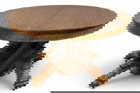 HIGHLY CARVED AMERICAN OAK DINING TABLE: LARGE AMERICAN OAK, SPLIT PEDESTAL LION CARVED DINING ROOM TABLE, MISSING MIDDLE LEG, NO LEAVES. 54" DIAM x 30" H. THIS ITEM EXCEEDS SIZE OR WEIGHT LIMITATIONS FOR IN HOUSE SHIPPING, MUST BE PICKED UP
