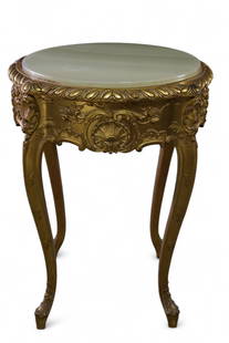 GOLD GILT FRENCH ONYX TOP LAMP TABLE: GOLD GILT BASE, ONYX TOP LAMP TABLE. 22" DIAM x 30" H. THIS ITEM EXCEEDS SIZE OR WEIGHT LIMITATIONS FOR IN HOUSE SHIPPING, MUST BE PICKED UP IN HOUSE OR SHIPPED VIA 3rd PARTY SHIPPER.