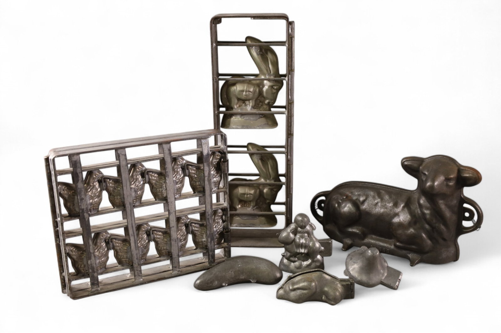 COLLECTION OF MOLDS: COLLECTION OF CHOCOLATE & ICE CREAM MOLDS, RABBITS, SHEEP, AND MORE. 16" H & 12" L