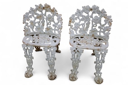 PAIR OF CAST IRON PATIO CHAIRS