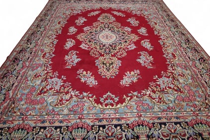 APPROX 10' x 13' HANDMADE WOOL RUG.