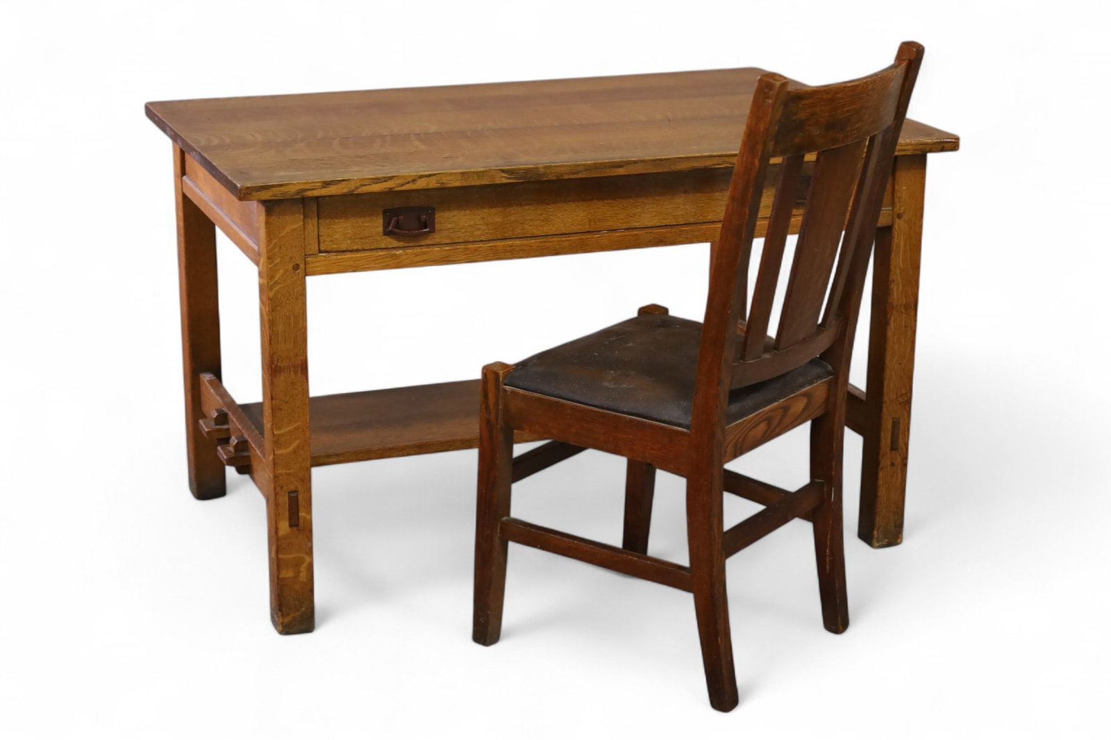 L. & J.G. STICKLEY DESK & CHAIR: ARTS & CRAFTS MISSION OAK DESK & CHAIR, DESK IS MARKED L. & J.G. ON INTERIOR OF DRAWER. WEAR TO FINISH. CHIPS. UNMARKED CHAIR. DESK 47 3/4" W x 29 3/4" D x 29 1/4" H. CHAIR, THIS ITEM EXCEEDS SIZE LIM