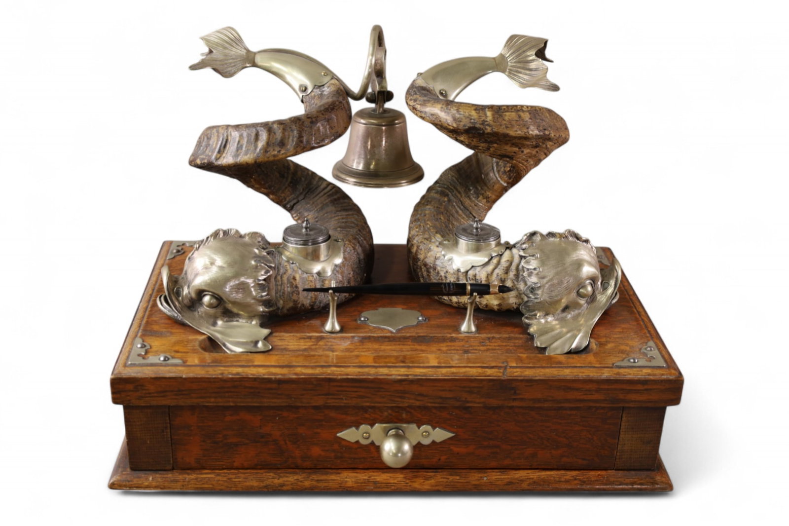 OAK DOUBLE INKWELL: ORNATE DOLPHIN FORM DOUBLE INKWELL, HORN AND SILVER DECORATED. RAMS HORN AND SILVERPLATE. WITH BELL AND STRIKER. LOWER DRAWER. 17 1/2" W x 10" D x 12 1/2" H.