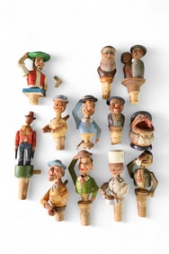 COLLECTION OF CARVED BOTTLE STOPPERS