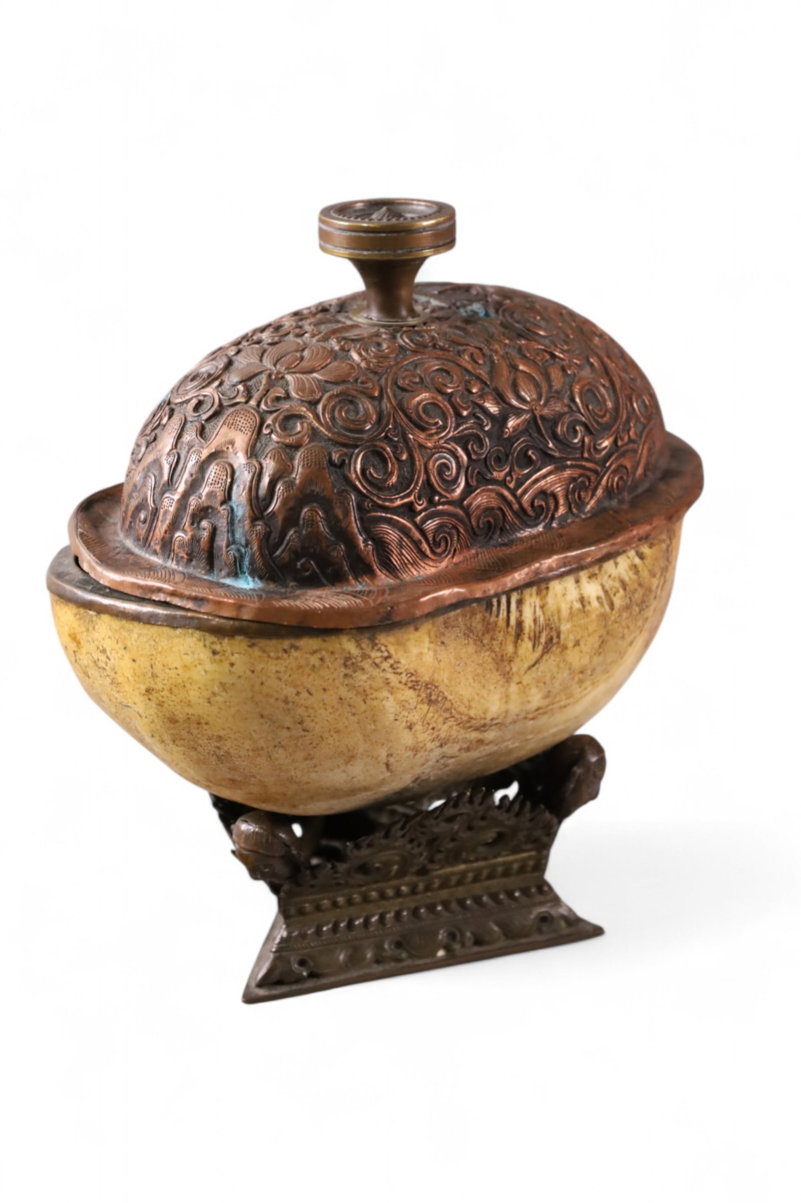 TIBETAN RITUAL SKULL CUP: TABLE TOP KAPALA TIBETAN RITUAL SKULL CUP. 7 1/2" L x 8 1/2" H.