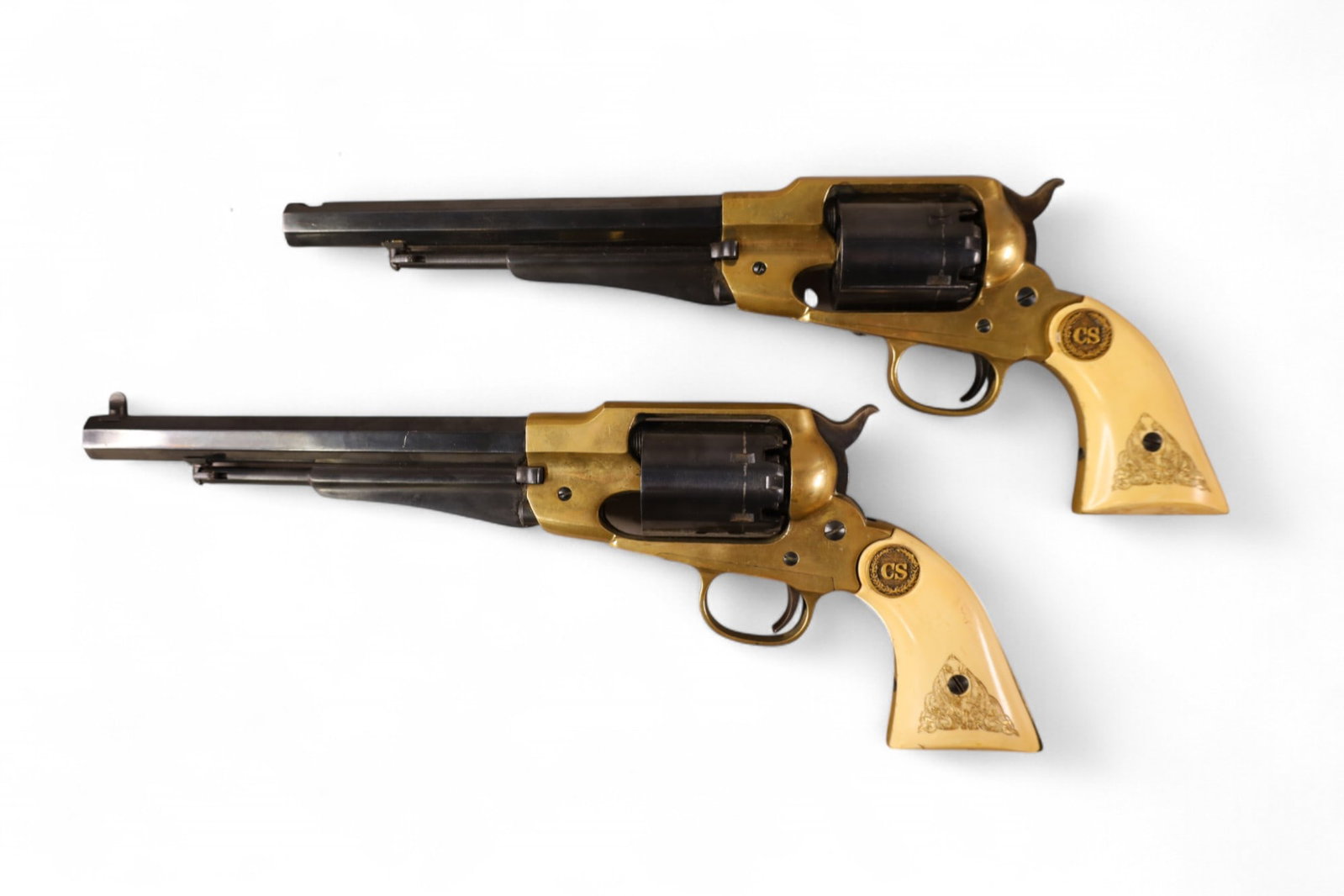PAIR OF PIETTA REMINGTON WALL HANGING REVOLVERS: PAIR OF PIETTA REMINGTON TEXAS BLACK POWDER 44 CALIBER REVOLVERS. CHIP TO ONE GRIP. 8" BARREL. 14" L