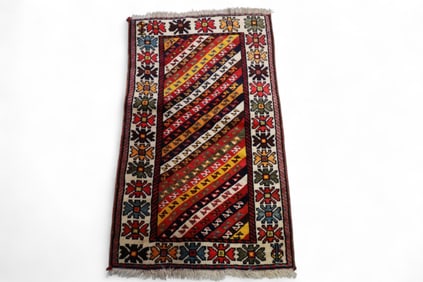 APPROX 3' 3" x 1' 11" HANDMADE WOOL RUG