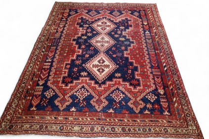 APPROX 5' 7" x 7' 6" HANDMADE WOOL RUG