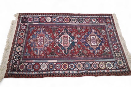 APPROX 6' 4" x 4' HANDMADE WOOL RUG