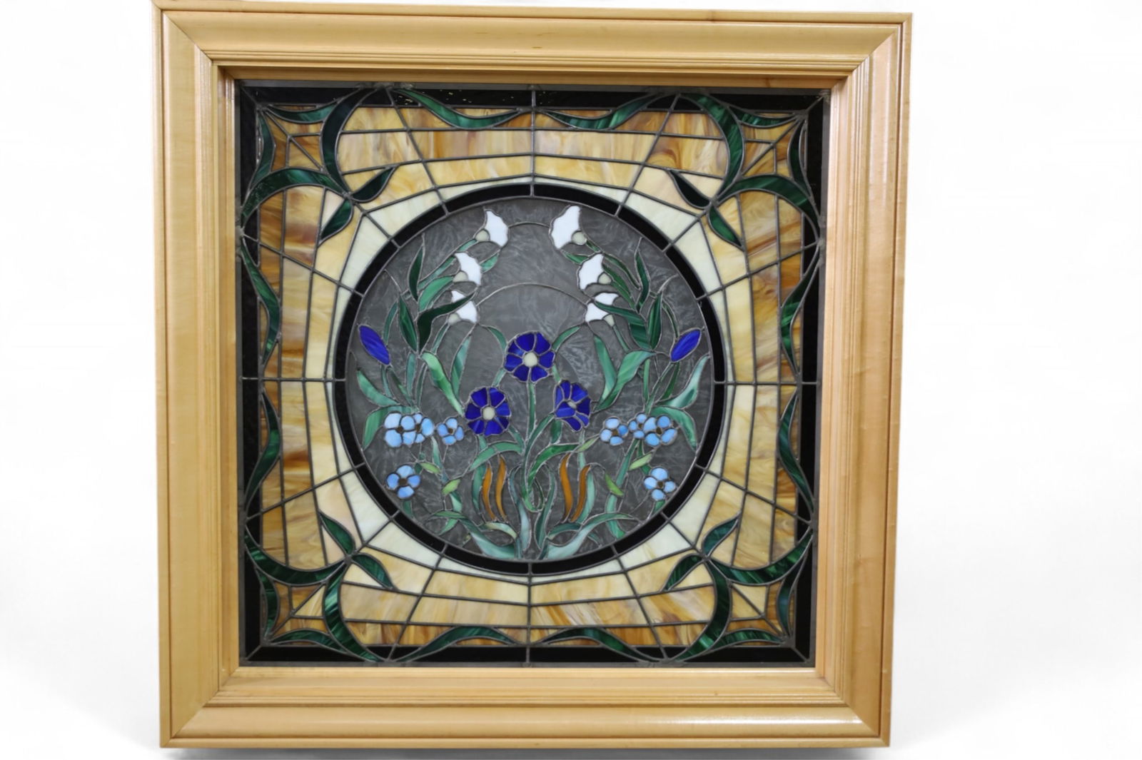 LARGE LEADED GLASS WINDOW: LARGE STAINED GLASS WINDOW IN CONTEMPORARY FRAME, FLORAL DECORATED. 43" x 43" IN FRAME. THIS ITEM EXCEEDS SIZE LIMITATIONS FOR IN HOUSE SHIPPING, MUST BE PICKED UP IN HOUSE OR SHIPPED VIA 3rd PARTY GR