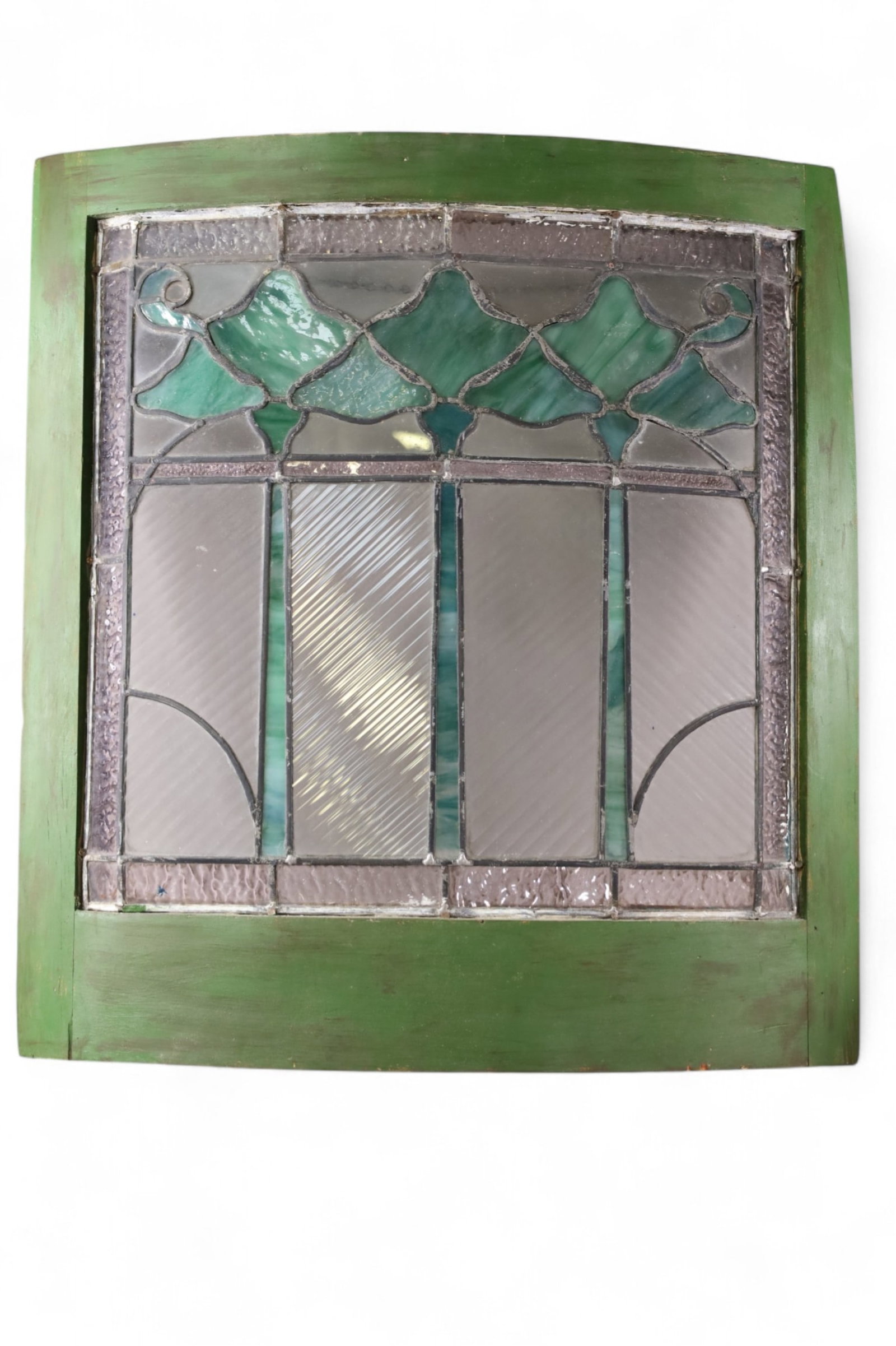 LEADED GLASS WINDOW: CURVED LEADED GLASS WINDOW IN WOODEN FRAME. 24" x 26 1/2" IN FRAME. THIS ITEM EXCEEDS SIZE LIMITATIONS FOR IN HOUSE SHIPPING, MUST BE PICKED UP IN HOUSE OR SHIPPED VIA 3rd PARTY GROUND SHIPPER.