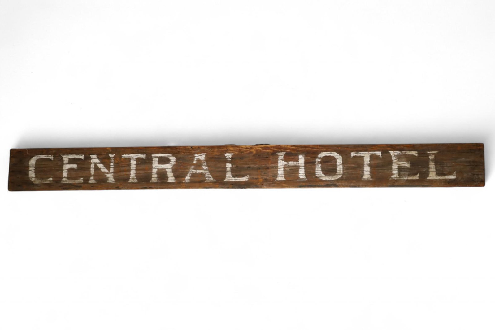 CENTRAL HOTEL WOODEN SIGN: PAINTED WOODEN SIGN, POSSIBLY FROM SAN BERNARDINO. 117" x 11" THIS ITEM EXCEEDS SIZE LIMITATIONS FOR IN HOUSE SHIPPING, MUST BE PICKED UP IN HOUSE OR SHIPPED VIA 3rd PARTY GROUND SHIPPER.