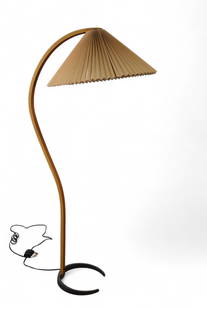 MADS CAPRANI FLOOR LAMP: BENTWOOD FLOOR LAMP BY MADS CAPRANI, WITH ORIGINAL SHADE. MARKED ON BASE. 23" DIAM x 60" H. THIS ITEM EXCEEDS SIZE LIMITATIONS FOR IN HOUSE SHIPPING, MUST BE PICKED UP IN HOUSE OR SHIPPED VIA 3rd PART