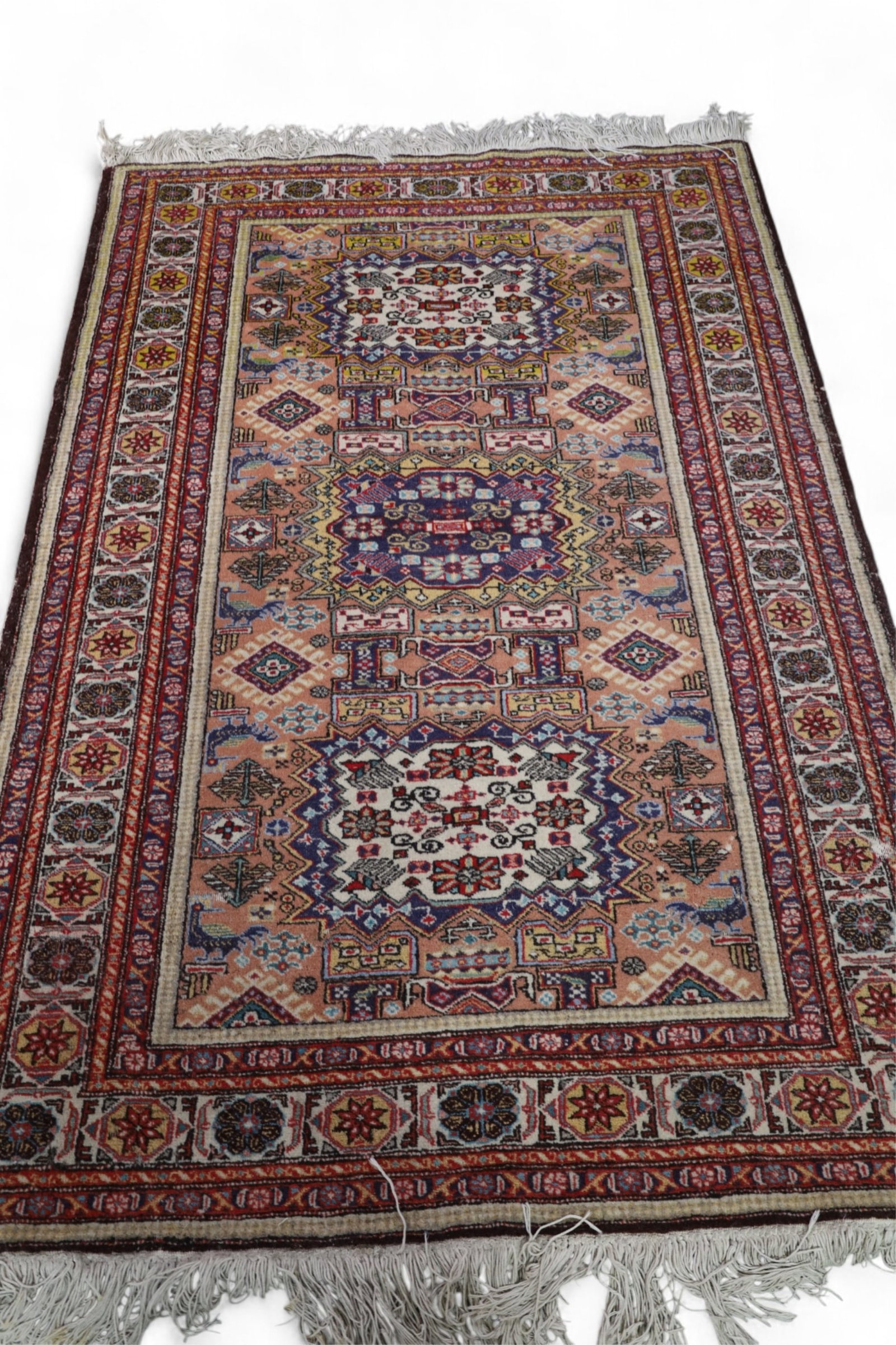 APPROX 6' 8" x 4' 6" HANDMADE WOOL RUG: HANDMADE WOOL RUG, NEEDS CLEANED. MOTH DAMAGE.