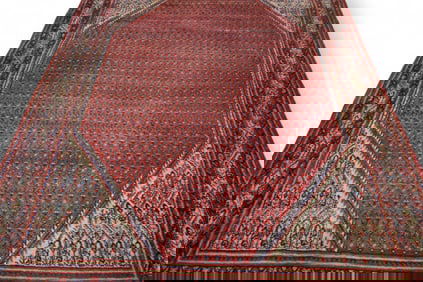 APPROX 9' 9" x 6' 11" HANDMADE WOOL RUG