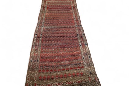 APPROX 8' 6" x 3' 3" HANDMADE WOOL RUG.