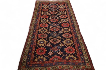 APPROX 7' 9" x 3' 8" HANDMADE WOOL RUG