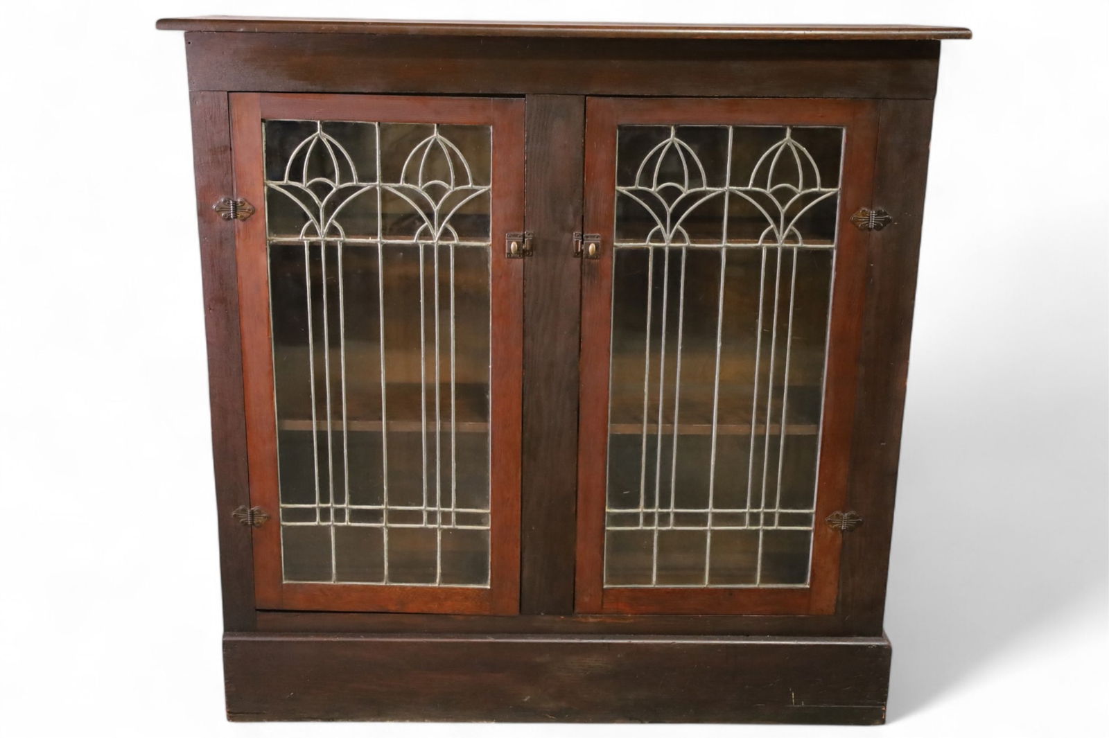 ARTS & CRAFTS CHINA CABINET: 2 DOOR ARTS & CRAFTS CHINE CABINET, LEADED DOORS. PART OF BUILT IN. 54" W x 14" D x 53" H. THIS ITEM EXCEEDS SIZE LIMITATIONS FOR IN HOUSE SHIPPING, MUST BE PICKED UP IN HOUSE OR SHIPPED VIA 3rd PARTY