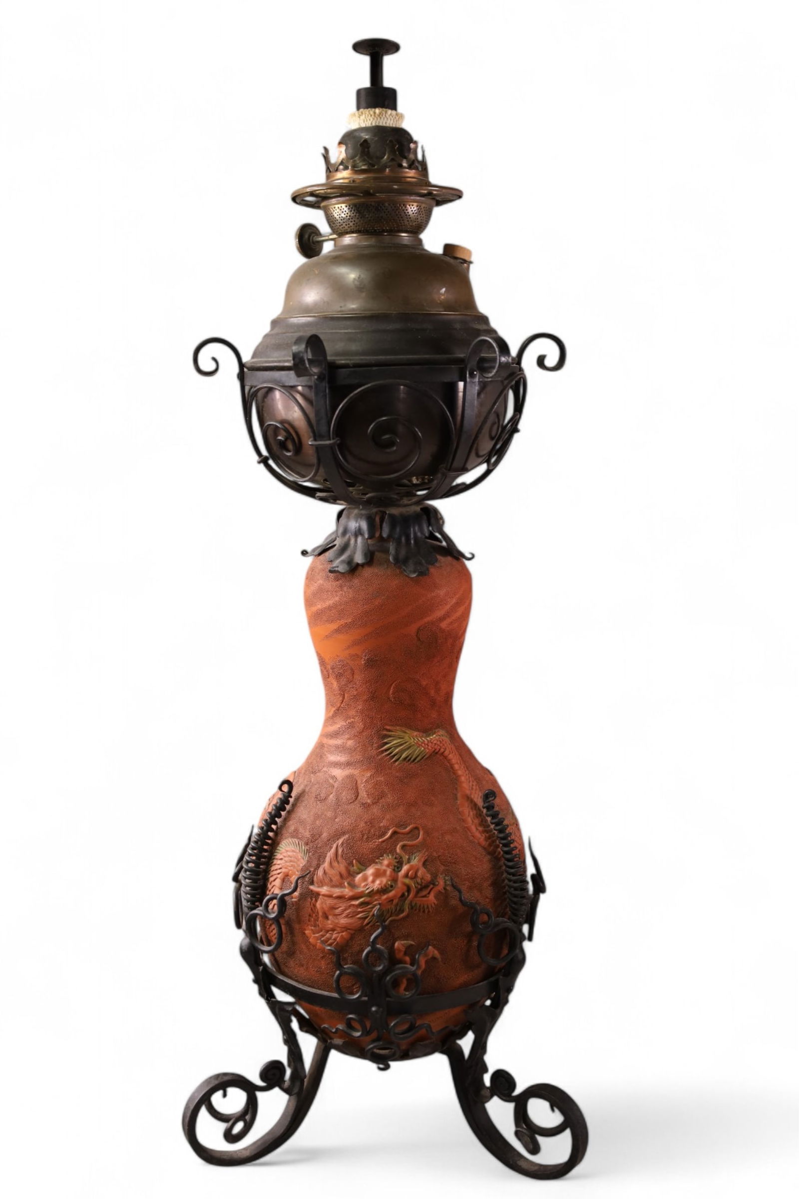 VICTORIAN ASIAN MOTIF OIL LAMP: TALL ASIAN OIL LAMP, IN METAL HOLDER. 30 1/2" H.