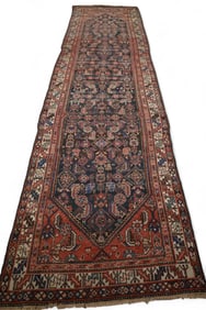 APPROX 12' 8" x 3' 5" HANDMADE WOOL RUG.