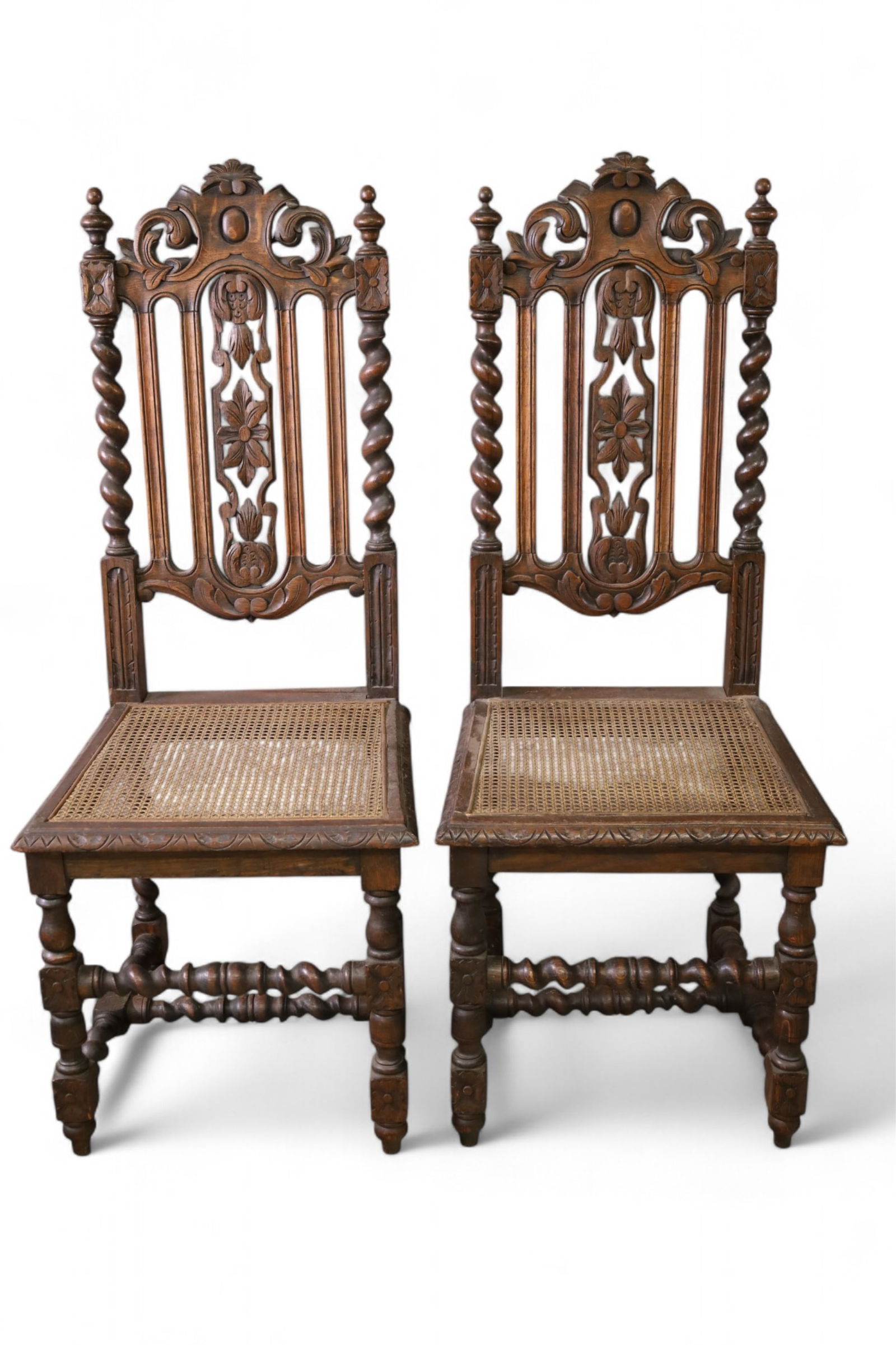 PAIR OF SIDE CHAIRS: PAIR OF HIGHLY CARVED SIDE CHAIRS WITH CANE SEATS. MINOR WEAR TO FINISH. 17" W x 16" D x 43" H. THIS ITEM EXCEEDS SIZE LIMITATIONS FOR IN HOUSE SHIPPING, MUST BE PICKED UP IN HOUSE OR SHIPPED VIA 3rd