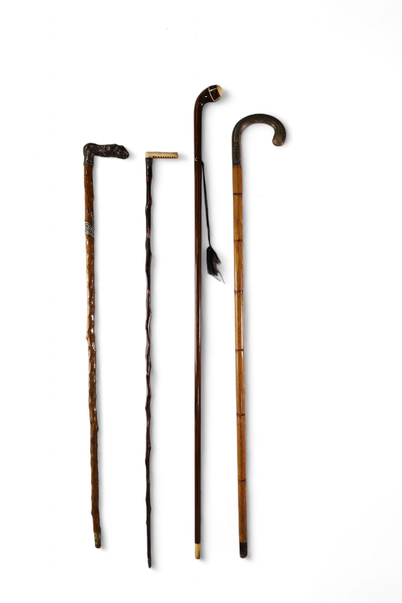 4 VICTORIAN WALKING STICKS: SILVERPLATED AND CLAW FOOT, BONE, & INLAID WALKING STICKS. 33" - 38" L.