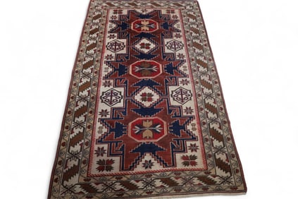 APPROX 5' 9" x 3' 6" HANDMADE WOOL RUG