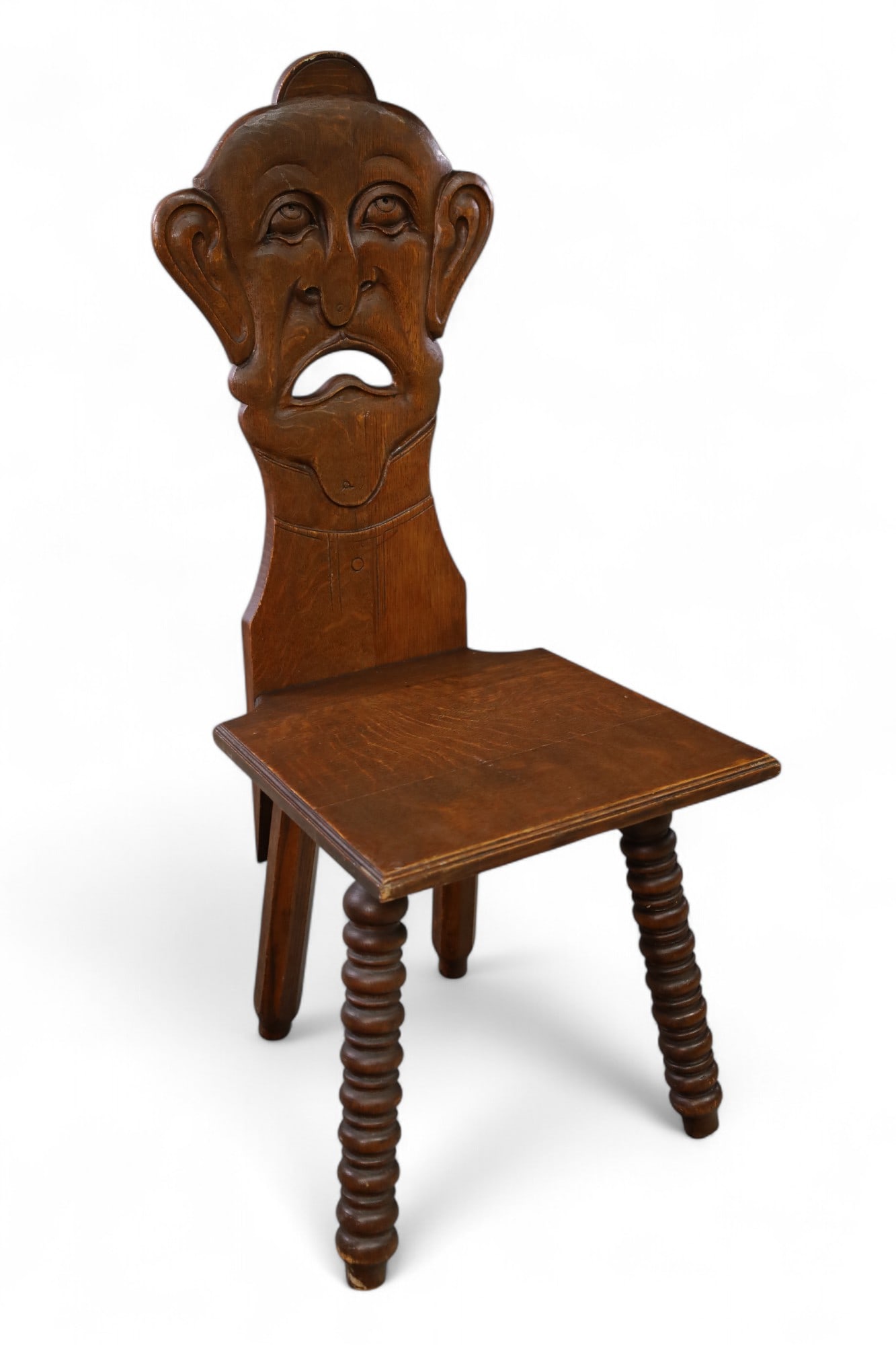 UNUSUAL CARVED OAK FIGURAL SIDE CHAIR: FIGURAL CARVED SIDE CHAIR, TURNED LEGS. 16" W x 16" D x 39 1/2" H. THIS ITEM EXCEEDS SIZE LIMITATIONS FOR IN HOUSE SHIPPING, MUST BE PICKED UP IN HOUSE OR SHIPPED VIA 3rd PARTY GROUND SHIPPER.