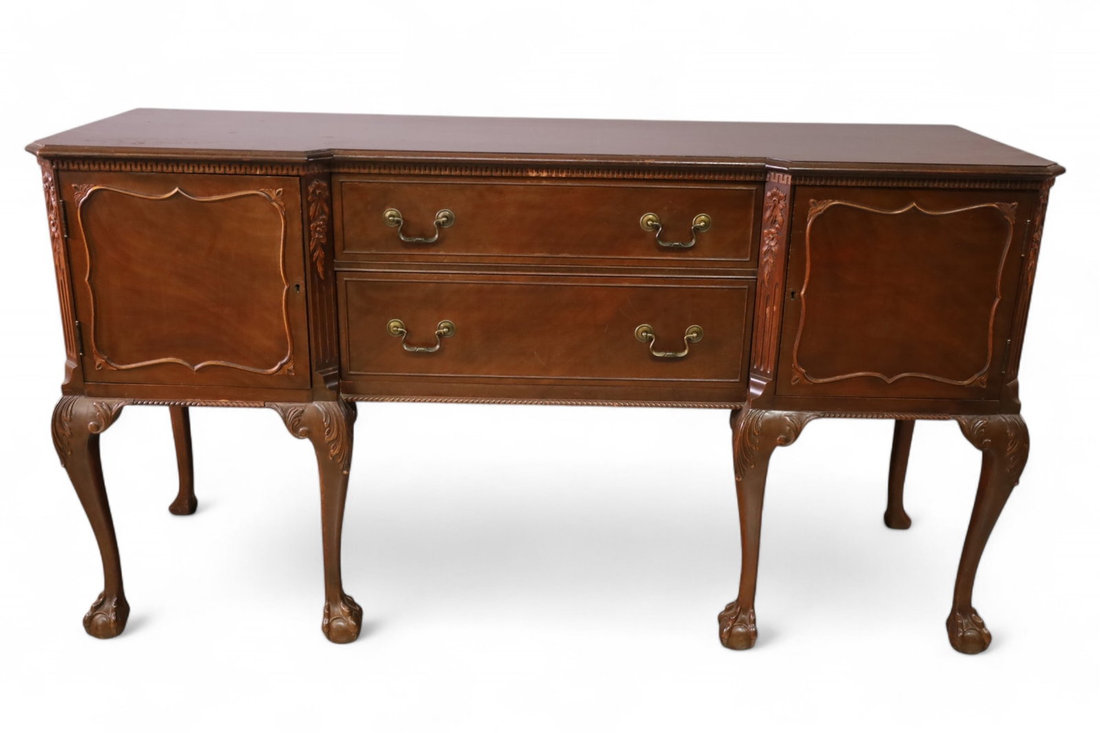 MAHOGANY BUFFET: CARVED MAHOGANY BUFFET, TWO DRAWER, TWO DOOR. BALL AND CLAW FOOT. WEAR TO FINISH. 68" W x 21" D x 37" H. THIS ITEM EXCEEDS SIZE LIMITATIONS FOR IN HOUSE SHIPPING, MUST BE PICKED UP IN HOUSE OR SHIPPED