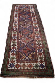 APPROX 10' x 3' 8" HANDMADE WOOL RUG