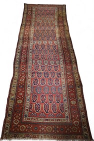 APPROX 9' x 3' HANDMADE WOOL RUG