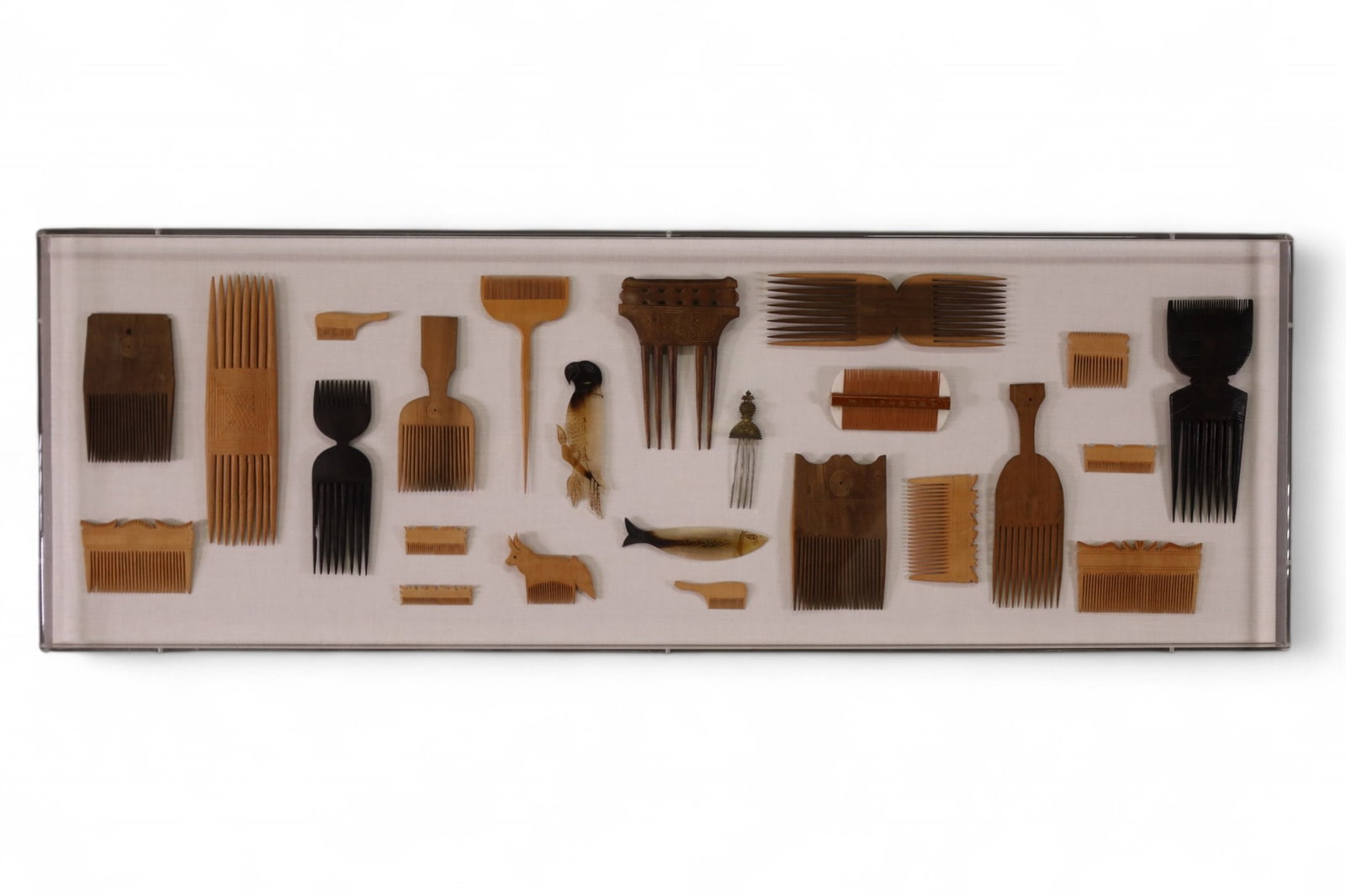 COLLECTION OF AFRICAN COMBS: BIRD AND FISH DECORATED COMBS, 45" x 15" THIS ITEM EXCEEDS SIZE LIMITATIONS FOR IN HOUSE SHIPPING, MUST BE PICKED UP IN HOUSE OR SHIPPED VIA 3rd PARTY GROUND SHIPPER.