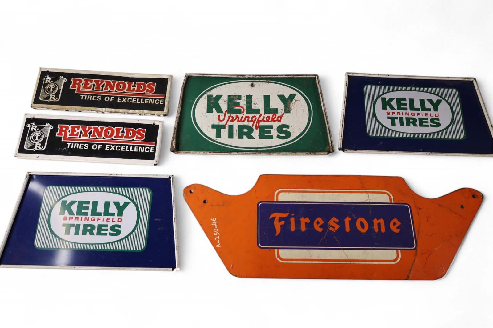 GROUPING OF TIRE SIGNS: 6 MISC TIRE SIGNS, KELLY TIRES, REYNOLDS, AND FIRESTONE. SCRATCHES. PAINT LOSS. 11" - 22" W