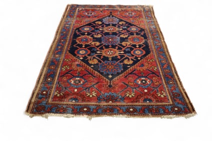 APPROX 4' 2" x 6' 3" HANDMADE WOOL RUG